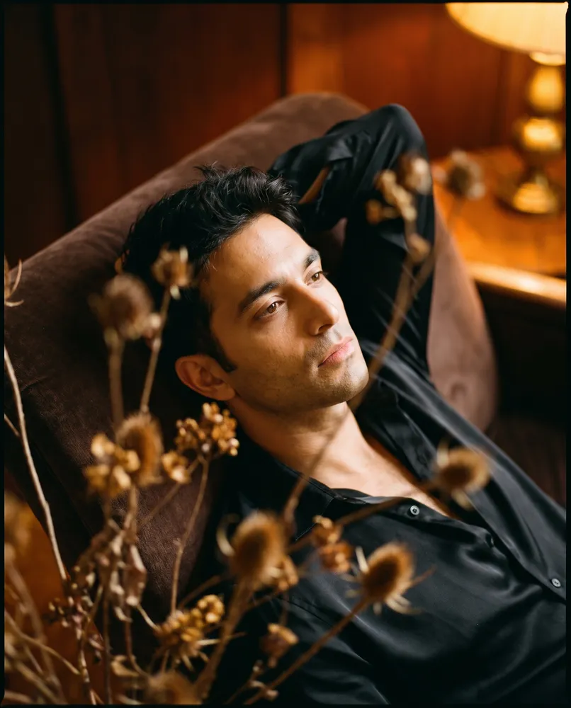 Man reclining on a chaise in warm light — AI · The o.KI Agency